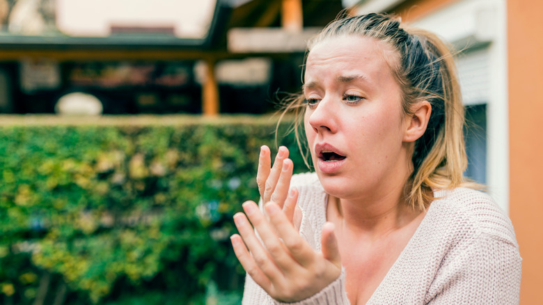 Woman sneezing