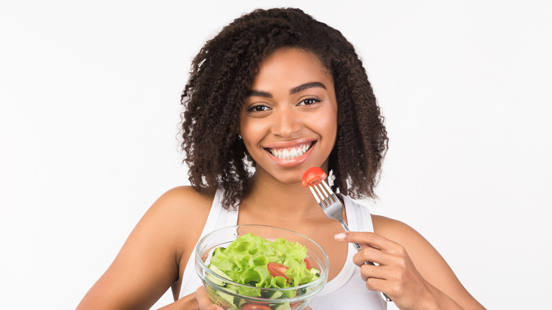 A woman eating salad