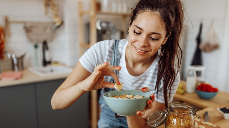 woman eating homemade breakfast