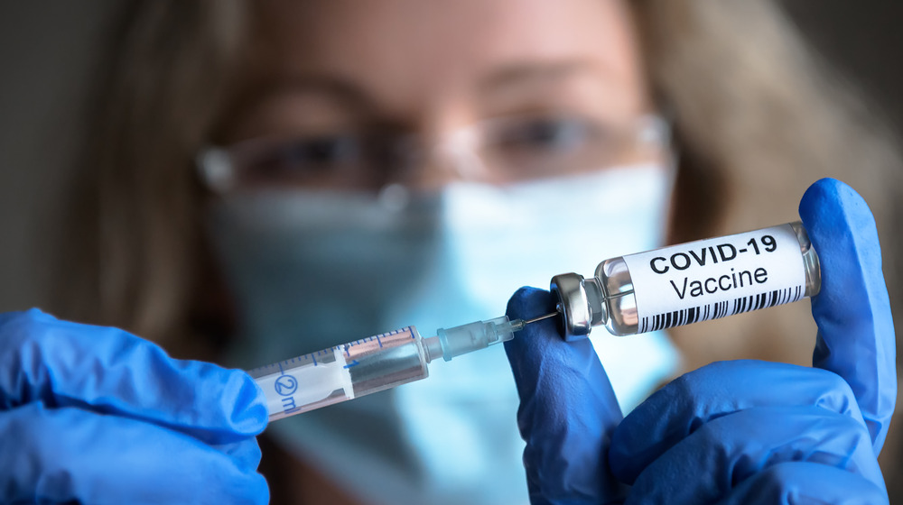 A woman giving a vaccine