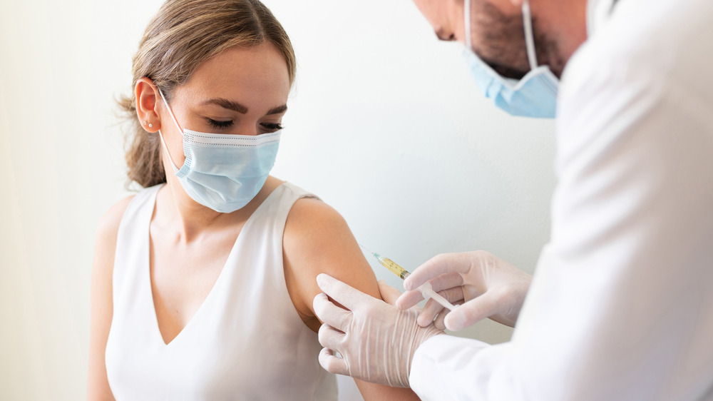 woman receiving a vaccine