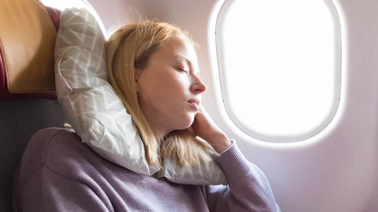 Woman sleeping on flight