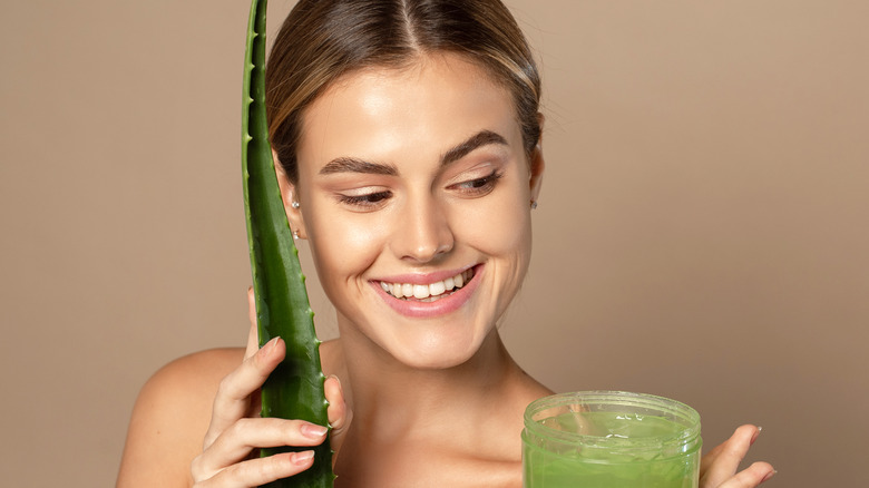 Woman with aloe and its gel
