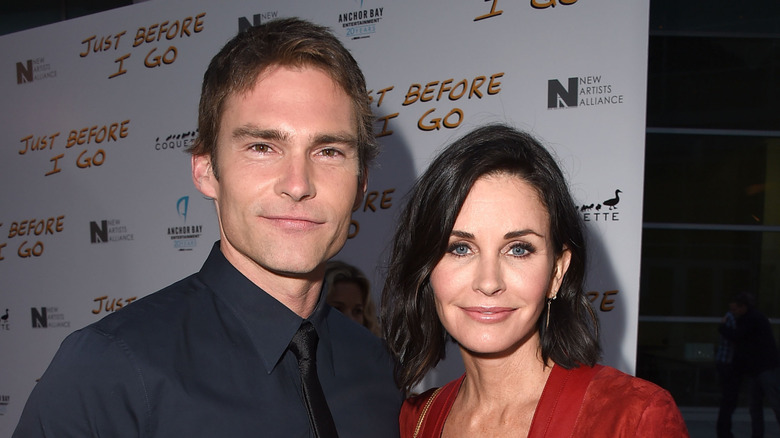 Seann William Scott posing with Courteney Cox at the premiere of Just Before I Go