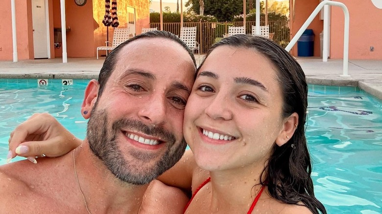Carmine Sabatella posing with his daughter in a pool