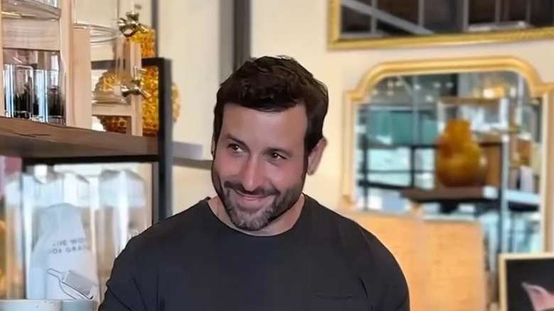 Carmine Sabatella smiling in his store