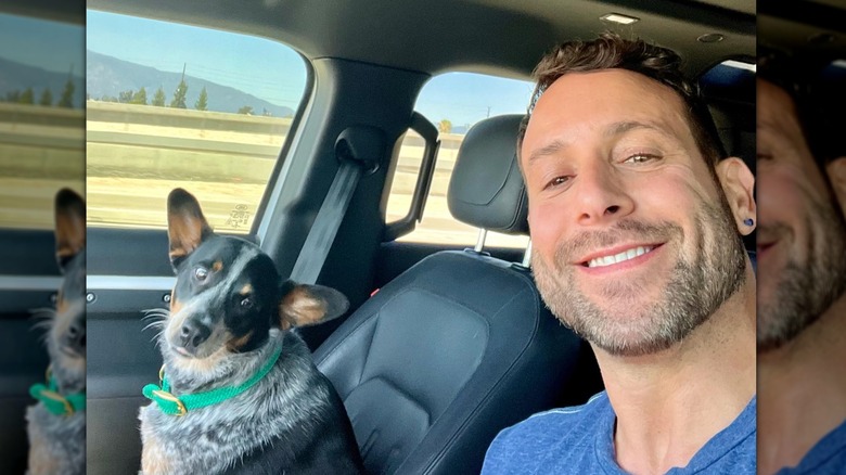 Carmine Sabatella driving with his dog