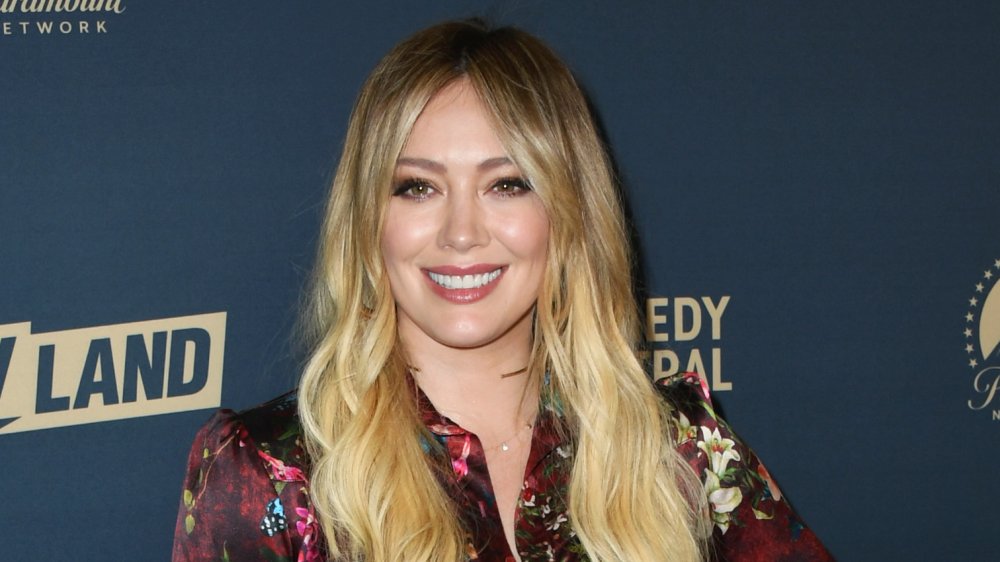 Hilary Duff on the red carpet, smiling