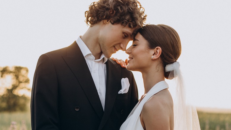 bride and groom smiling together