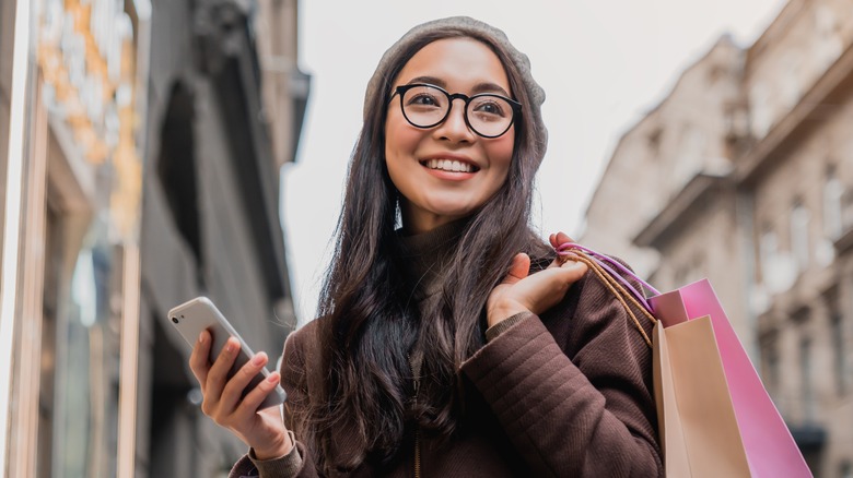 Smiling woman with shopping bags