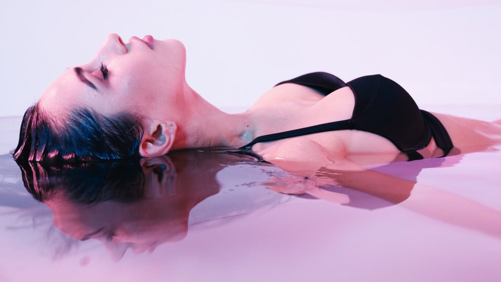 Woman in floatation tank