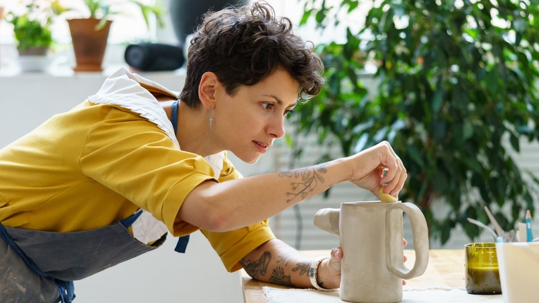 Woman making pottery