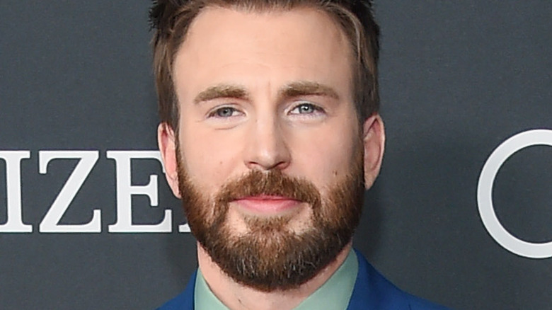 Chris Evans poses on the red carpet