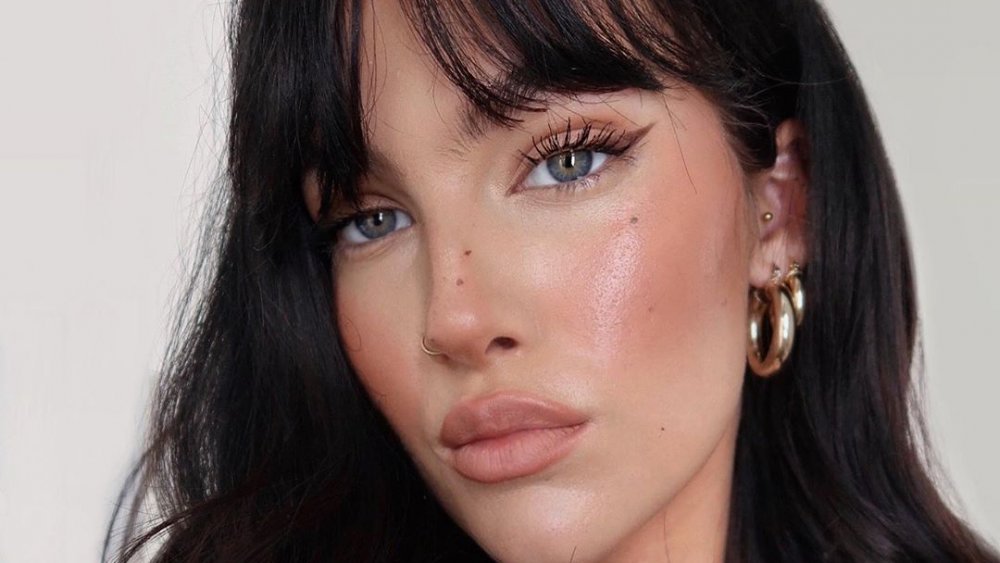 Model with dolphin skin makeup