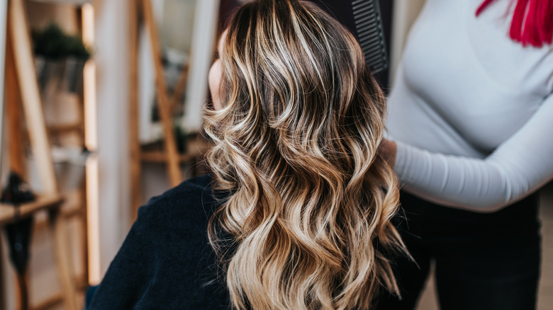 woman sitting in salon chair 