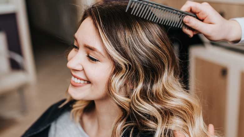 Woman with balayage at salon