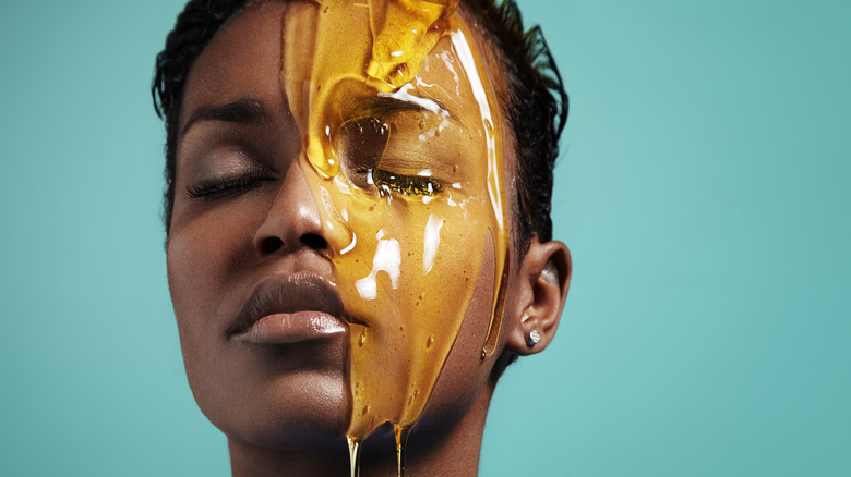 Woman with honey on face