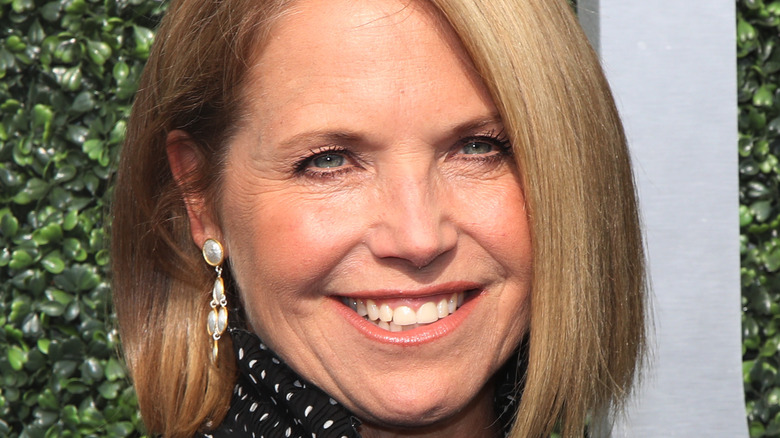 Katie Couric smiles at an event