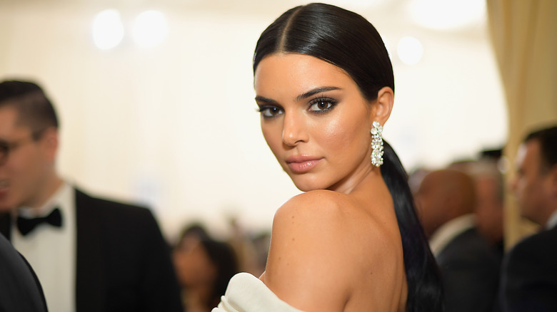 Kendall Jenner poses at an event 