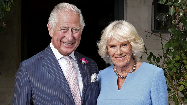 King Charles and Queen Camilla smiling