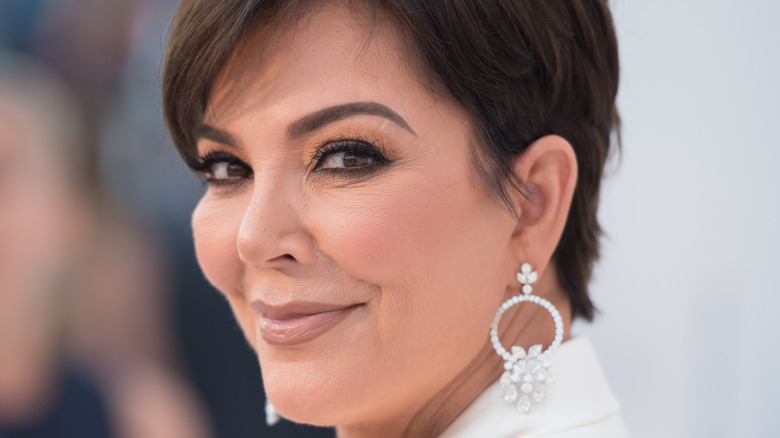 Kris Jenner smiling on the red carpet. 