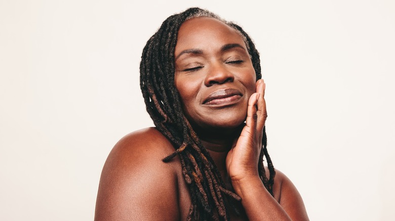 Middle aged woman with dreadlocks 