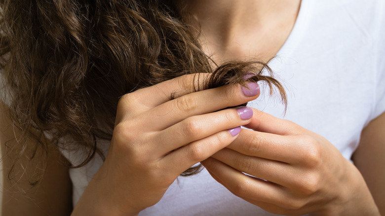 A woman touching her hair