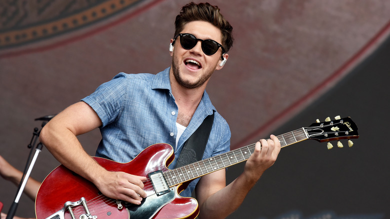 Niall Horan performs on stage. 