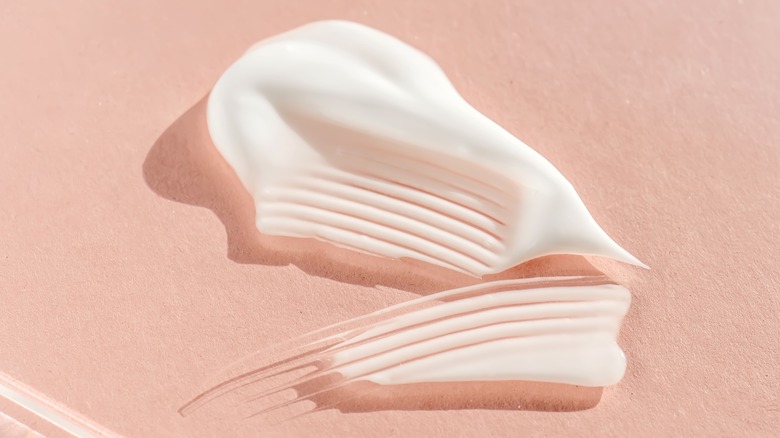 cream on pink background