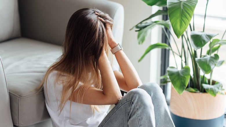 Anxious woman sitting down