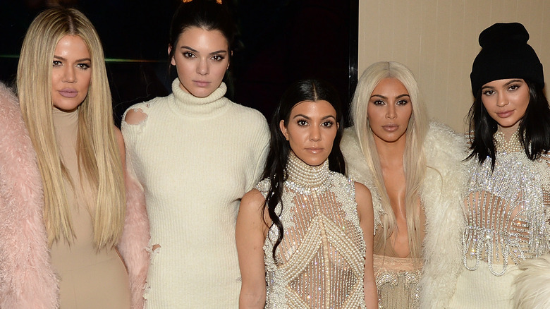 The Kardashian/Jenner sisters at an event.