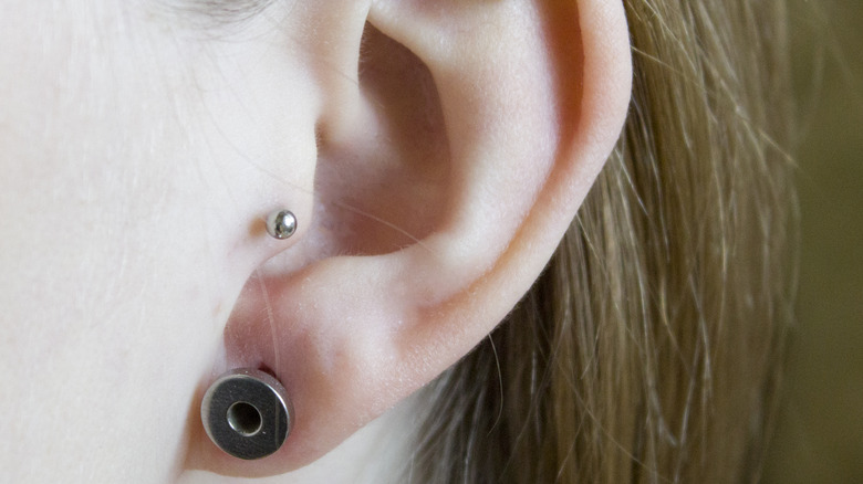 Woman with an ear gauge