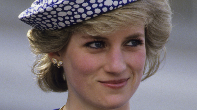 Princess Diana smiling in hat