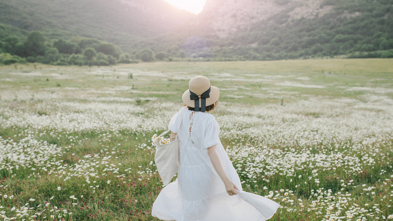 Woman in field of flowers