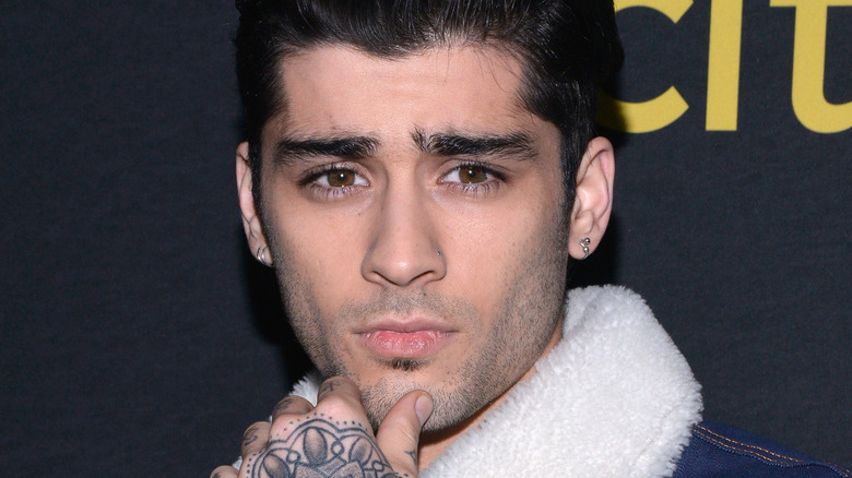 Zayn Malik posing at an event.
