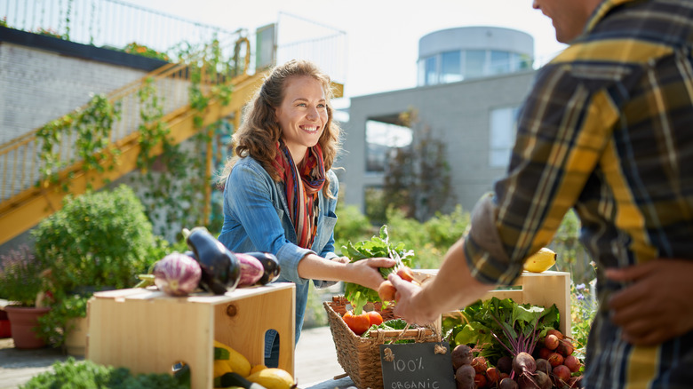 Woman selling products from her farm at a market