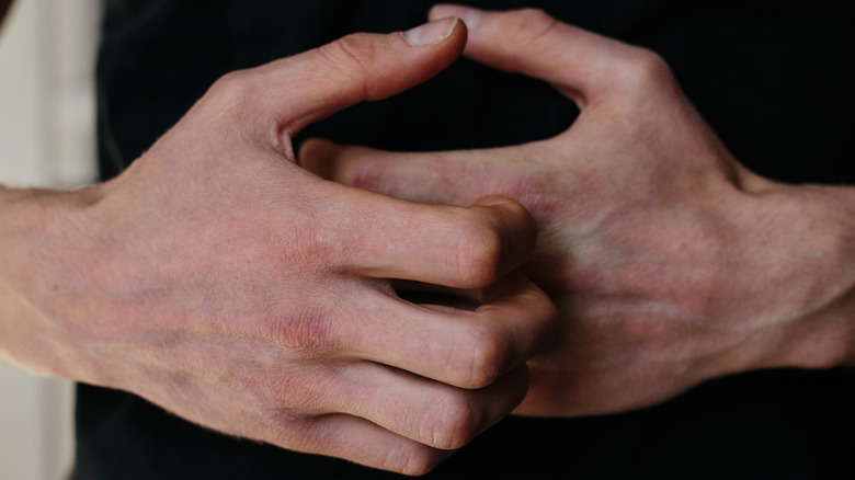 Itchy fingers being scratched