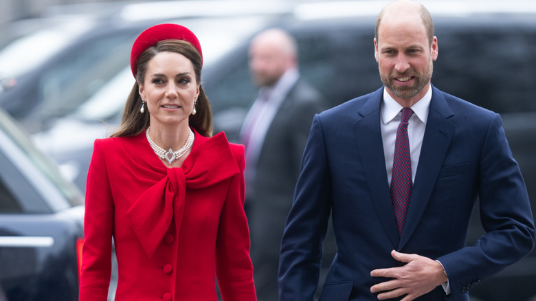 Kate Middleton in an all-red outfit and pearl necklace