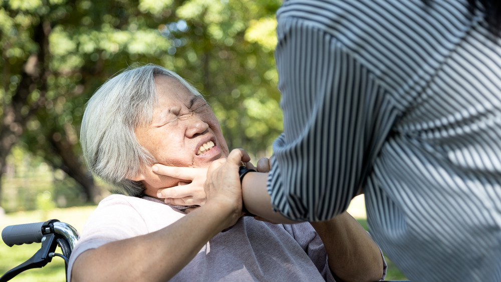 A woman being strangled 