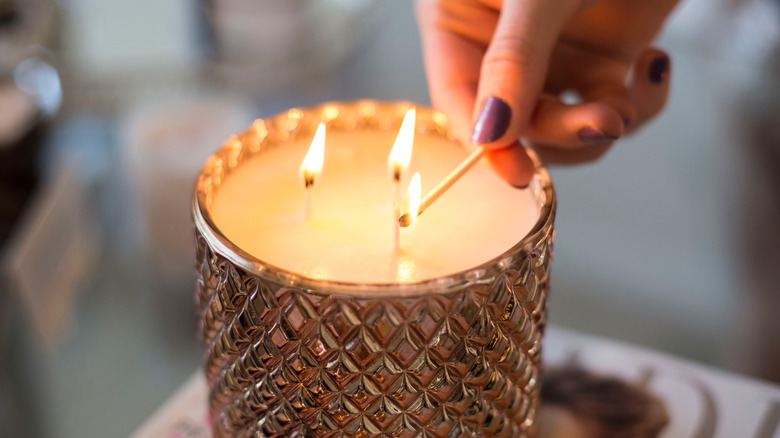 Woman lighting a candle