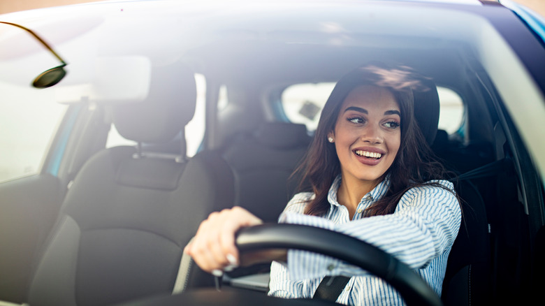 A woman driving a car 