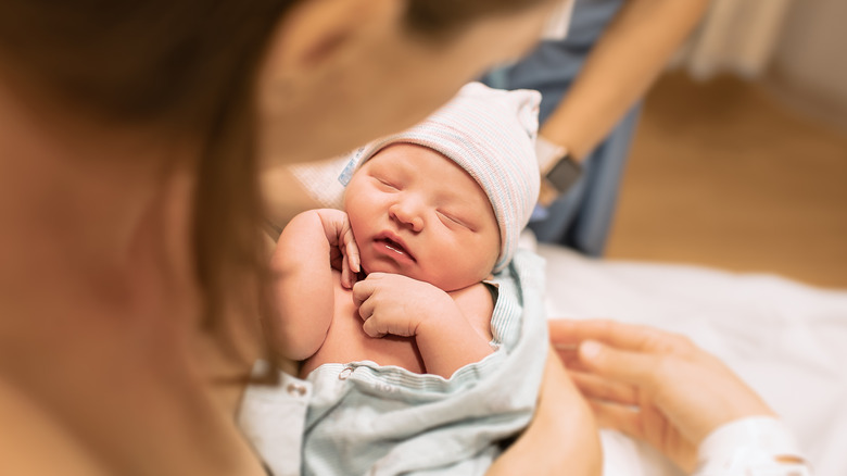 mom holding newborn baby