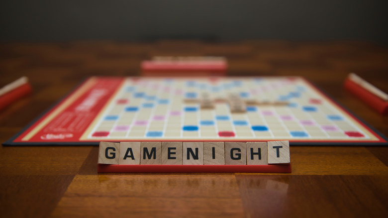 Board game with "Game Night" spelled out in Scrabble tiles