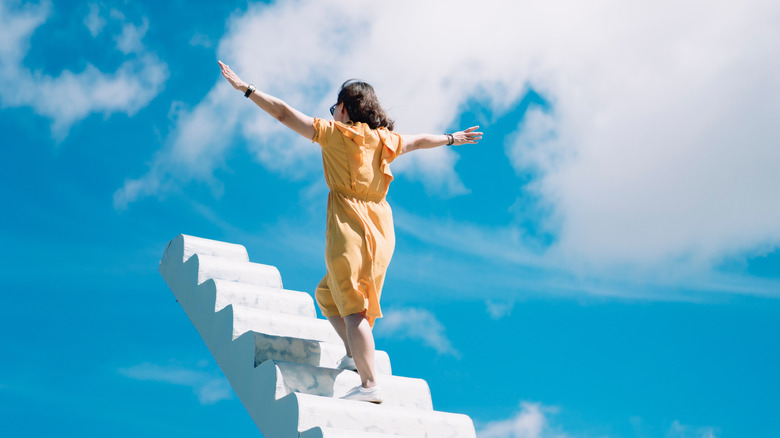 Woman climbing staircase 