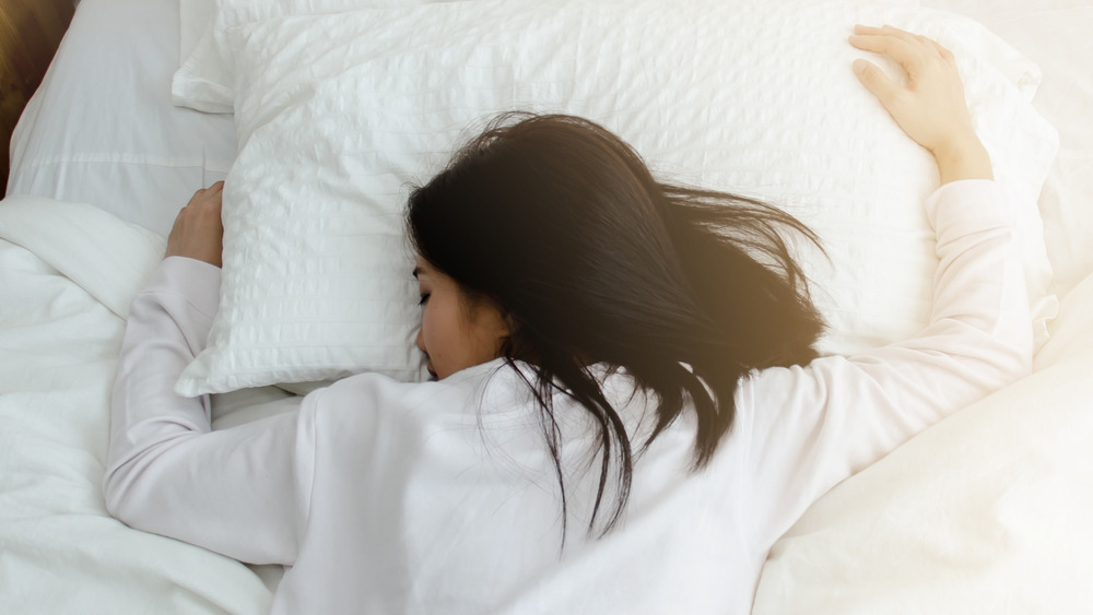 Woman asleep in bed