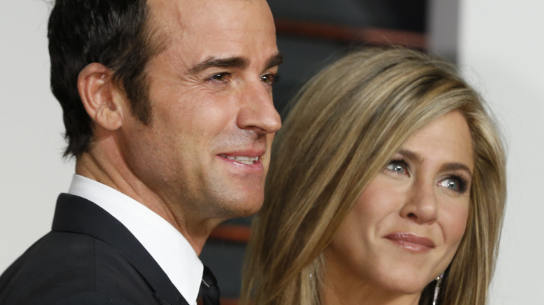 Jennifer Aniston and Justin Theroux smile on red carpet