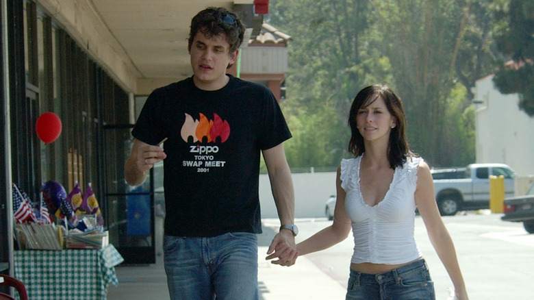 John Mayer and Jennifer Love Hewitt walking hand in hand