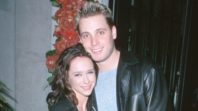 Richard Cronin and Jennifer Love Hewitt smiling and posing together
