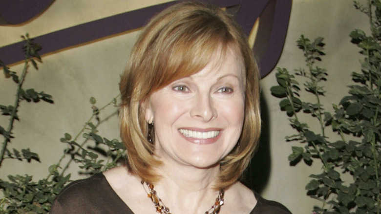 Jenny Jones smiling while posing for photos