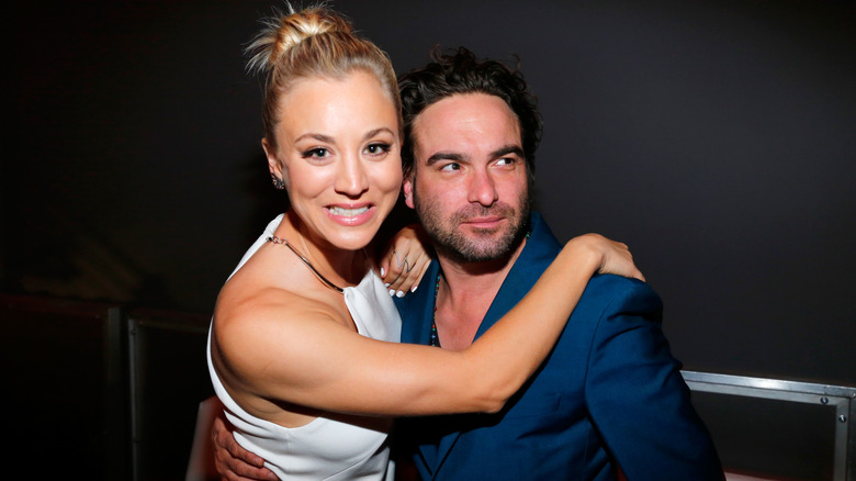 Kaley Cuoco is hugging and posing with Johnny Galecki as they attend the Fallout 4 video game launch event in downtown Los Angeles (2015)